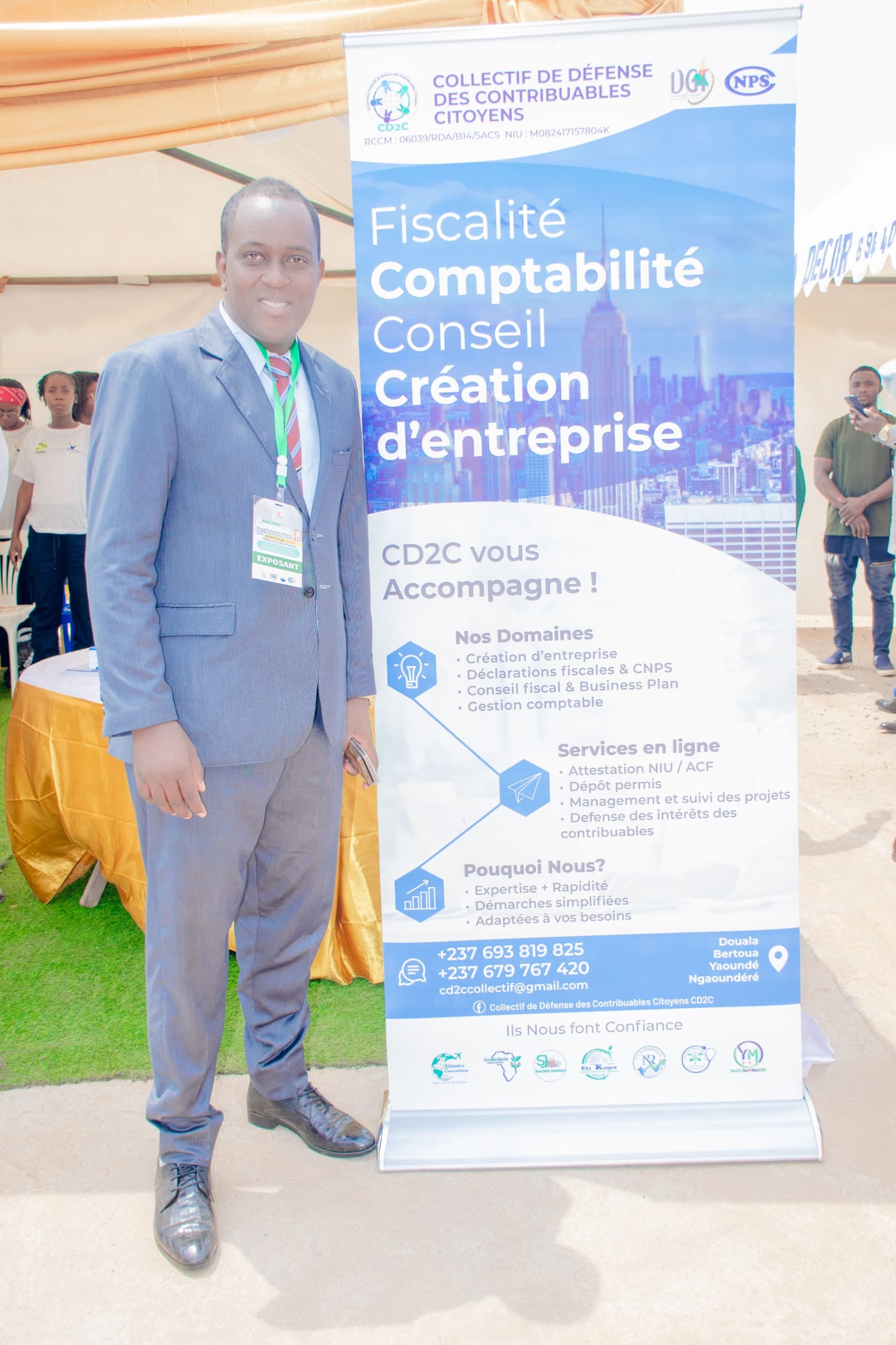 Représentant CD2C au salon PME avec bannière officielle